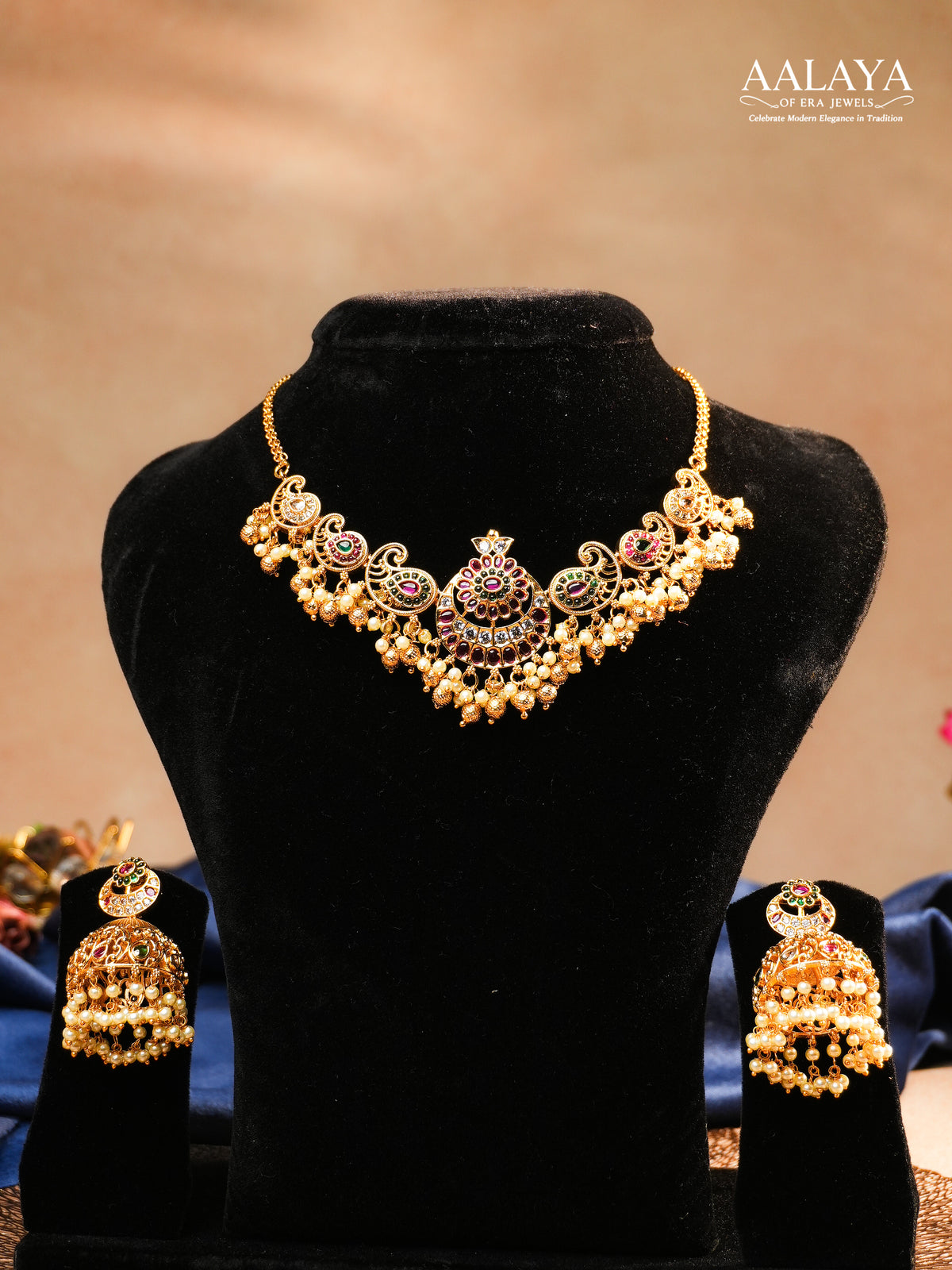 Aalaya Kundan Necklace Set with Paisley Motifs & Pearl Jhumkas