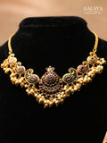 Aalaya Kundan Necklace Set with Paisley Motifs & Pearl Jhumkas